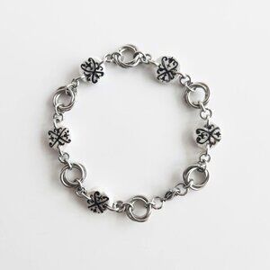 Iridescent victorian gothic and mobius rose silver charm bracelet